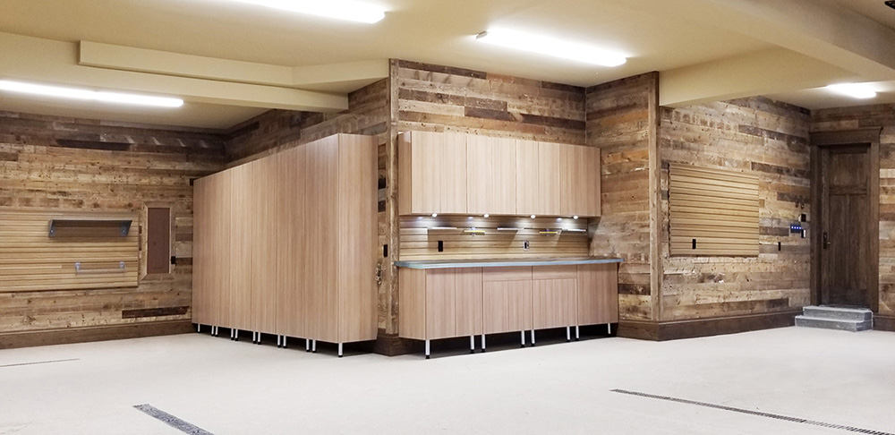 garage-epoxy-floor-wood-cabinetry-wood-wall-lighting-countertop