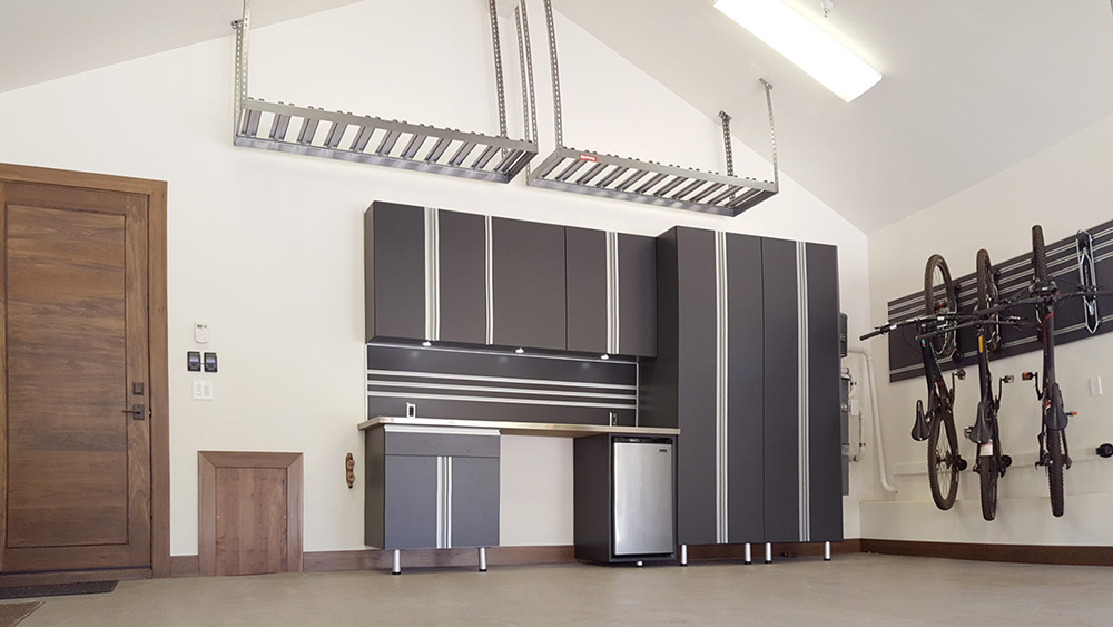 garage-cabinets-chrome-countertop-epoxy-lighting-door