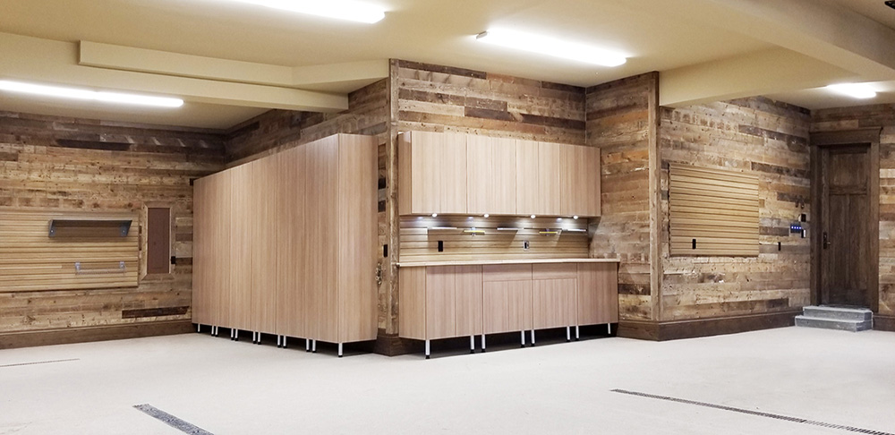 garage-epoxy-floor-wood-cabinetry-wood-wall-lighting