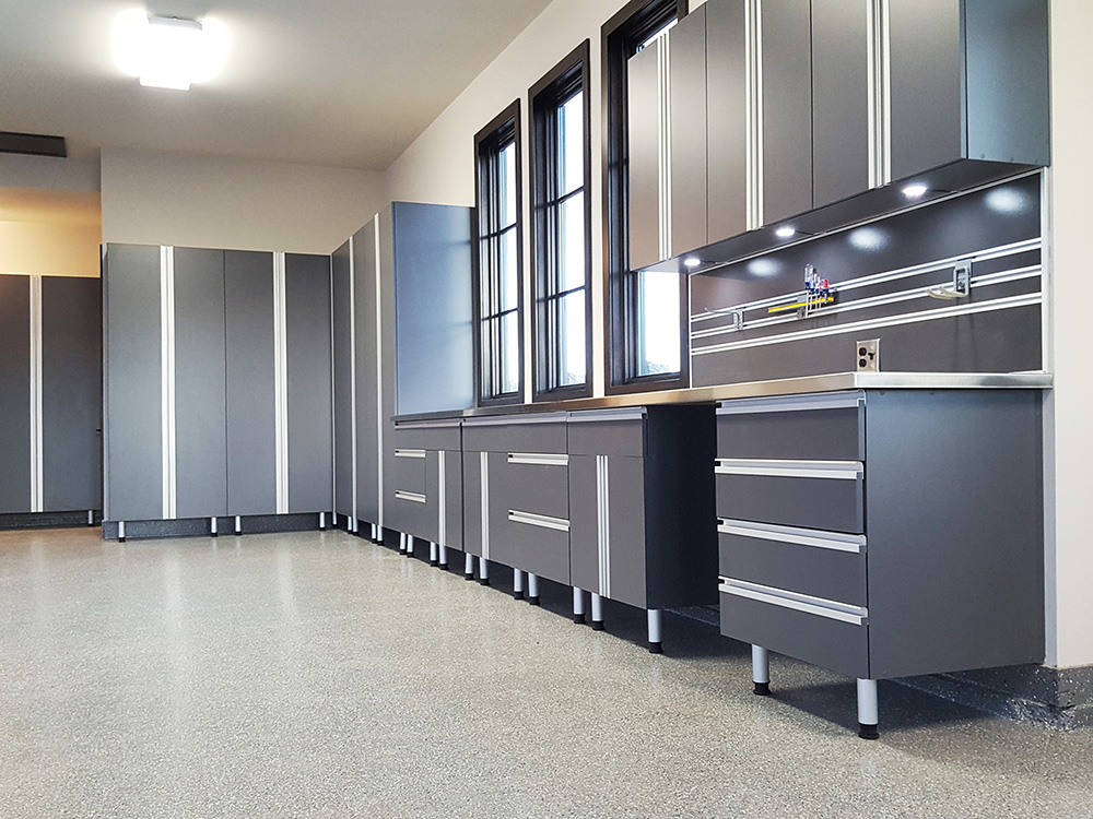 garage-showcase-grey-lighting-cabinets-steel-countertop-drawers